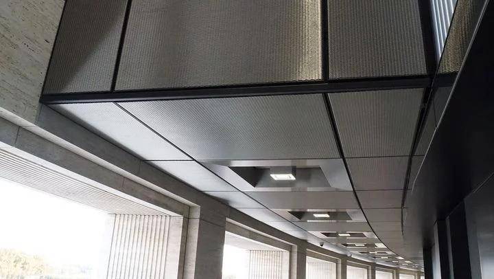 Wall and ceiling covering made out of shiny stainless steel wire mesh.