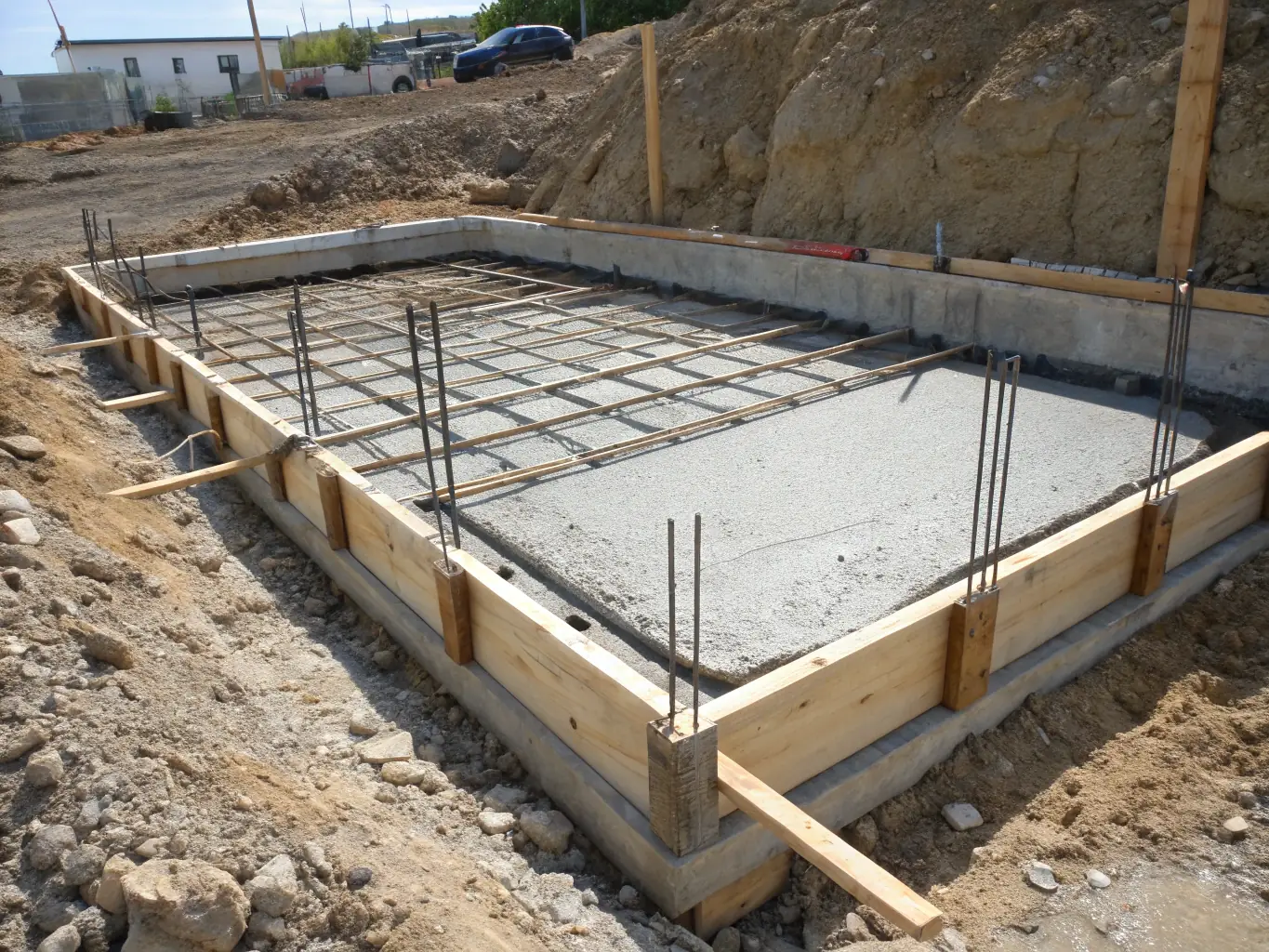 An image of metal wire mesh being used to reinforce concrete in a construction project, demonstrating its role in enhancing structural integrity and longevity.
