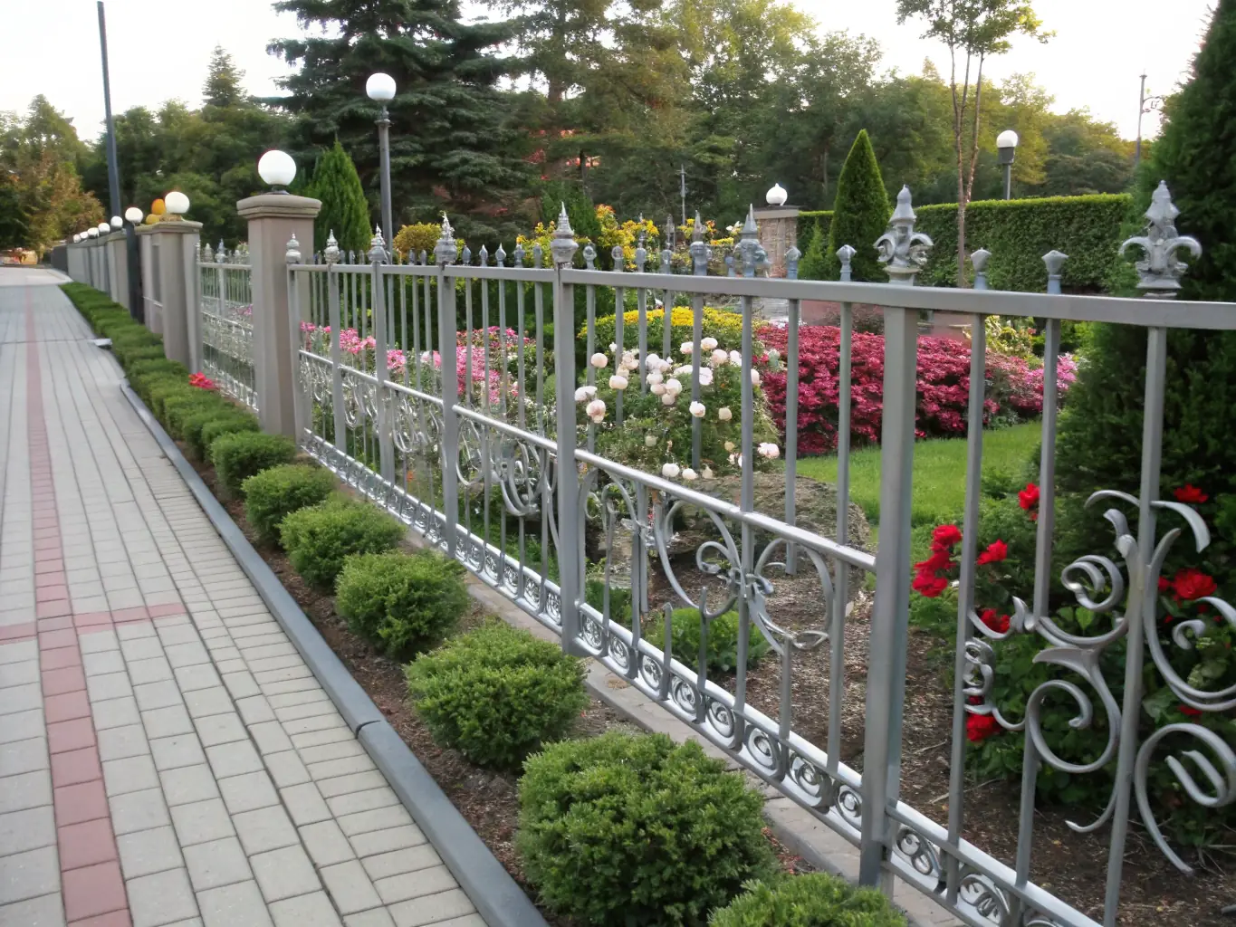 An image of a wrought iron fence seamlessly integrated into a commercial landscape, showcasing its timeless elegance and ability to complement various architectural styles.