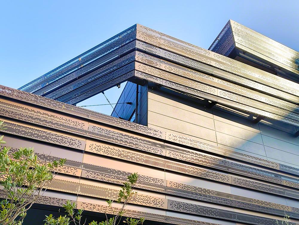 Architectural metal mesh facade installed on a modern commercial building