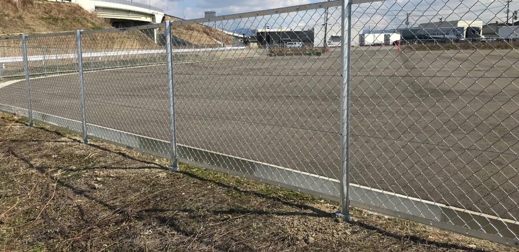 Chain link fence protecting an industrial facility