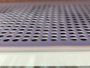 Close-up of Perforated Metal Sheet with Circular Holes