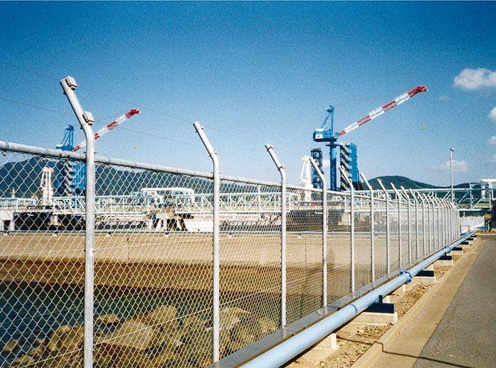 Industrial chain link fencing used for perimeter protection and access control