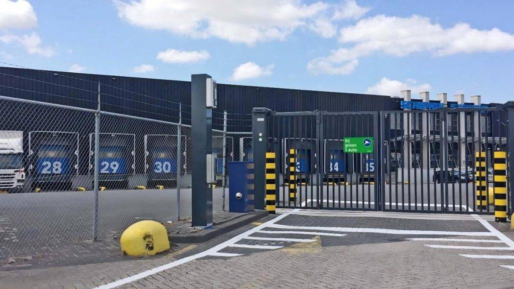 Warehouse loading dock protected by perimeter fencing