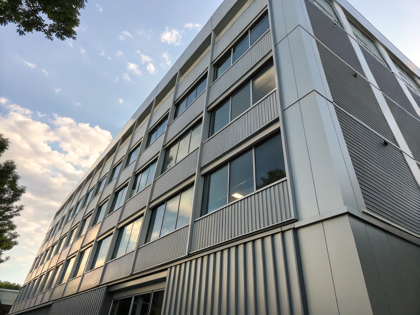 Architectural perforated metal facade screens and decorative wall panels