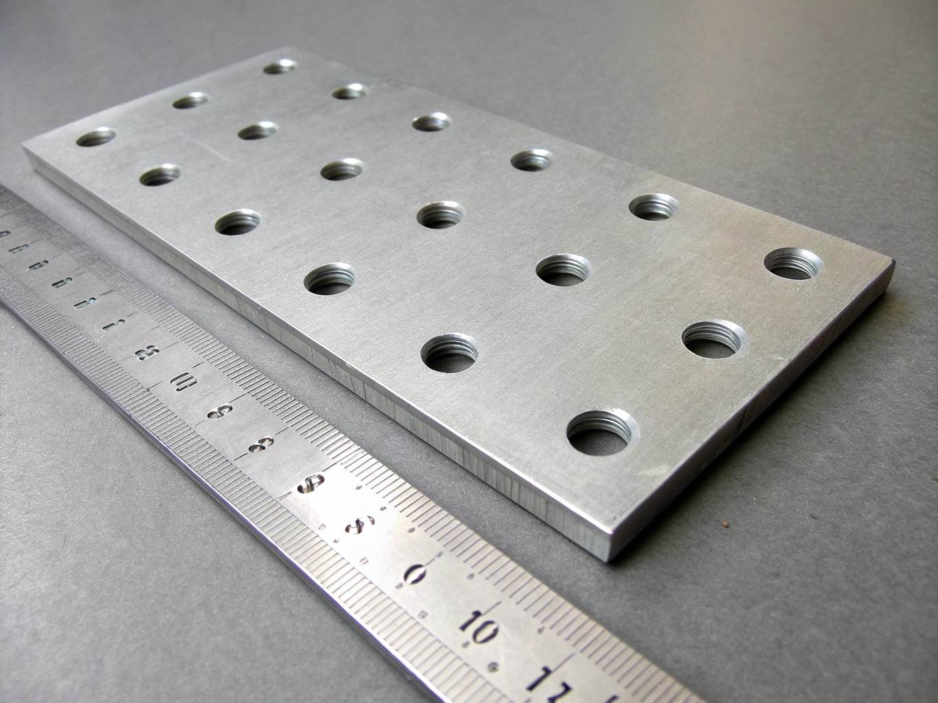 Precision perforated metal sheet with clean circular pattern layout