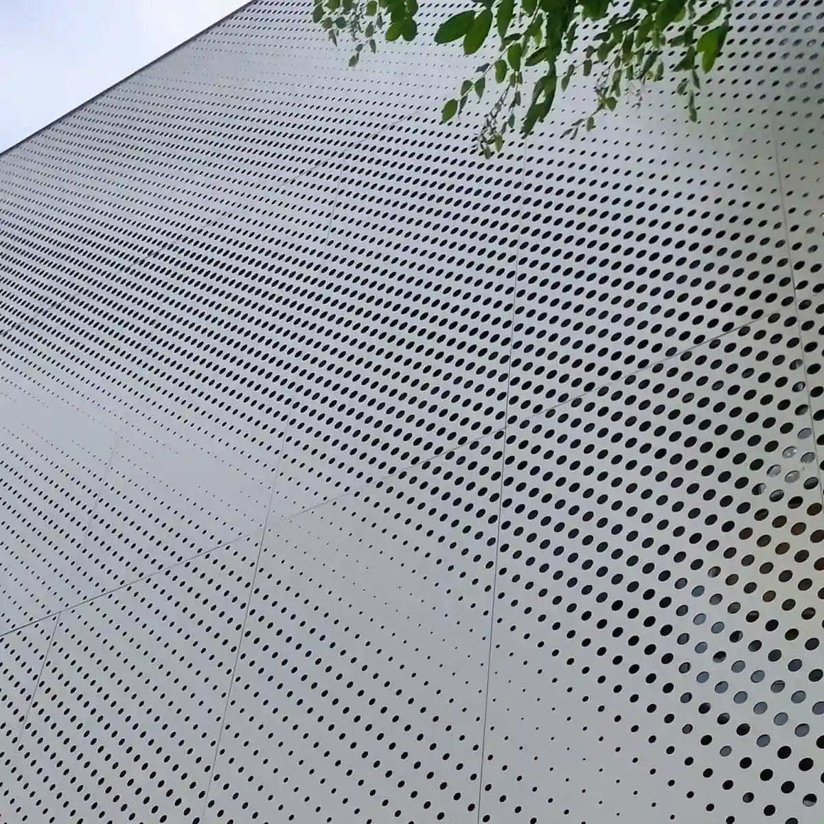 Architectural perforated metal facade screens and decorative wall panels