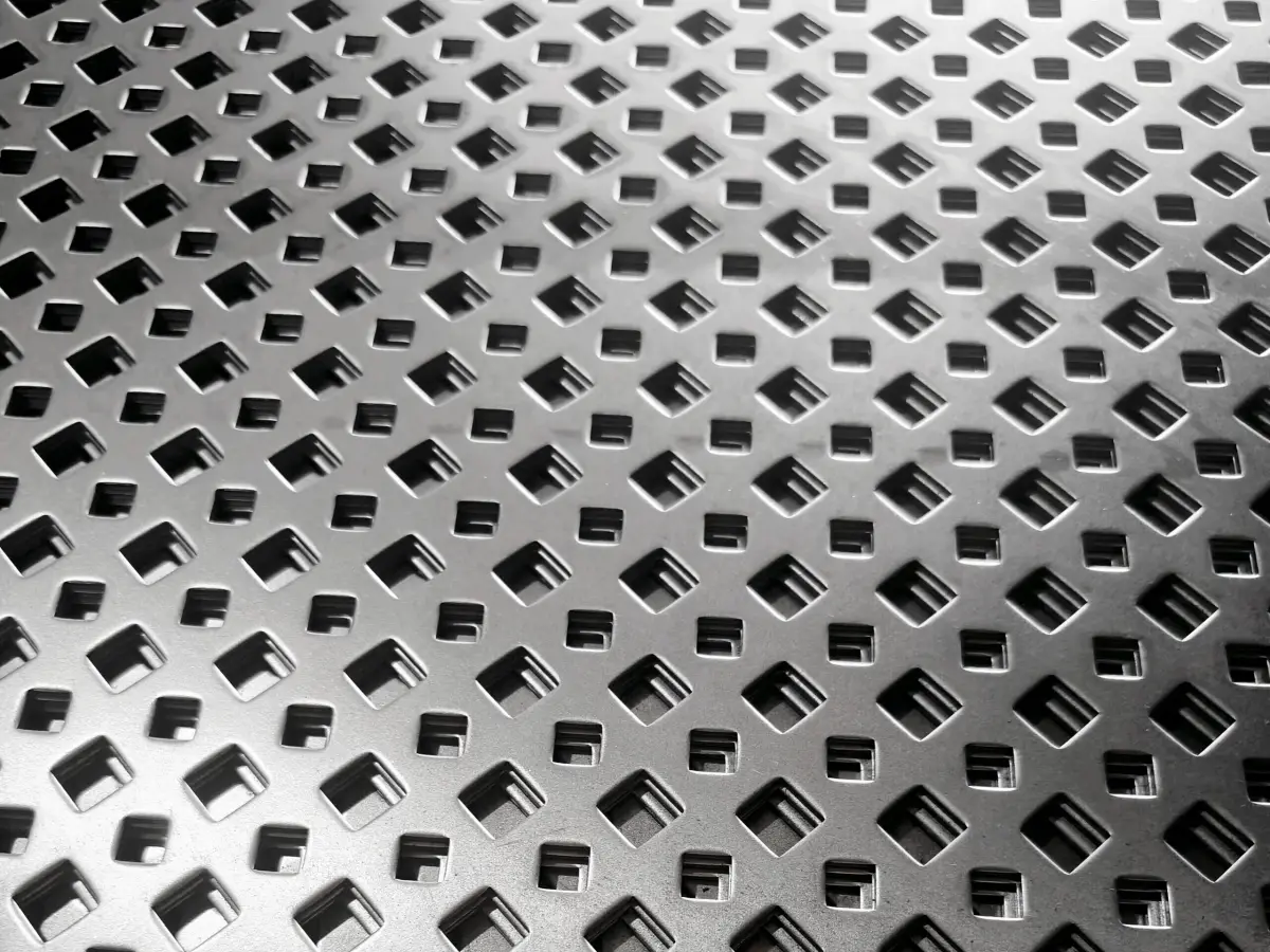 Precision perforated metal sheet with clean circular pattern layout