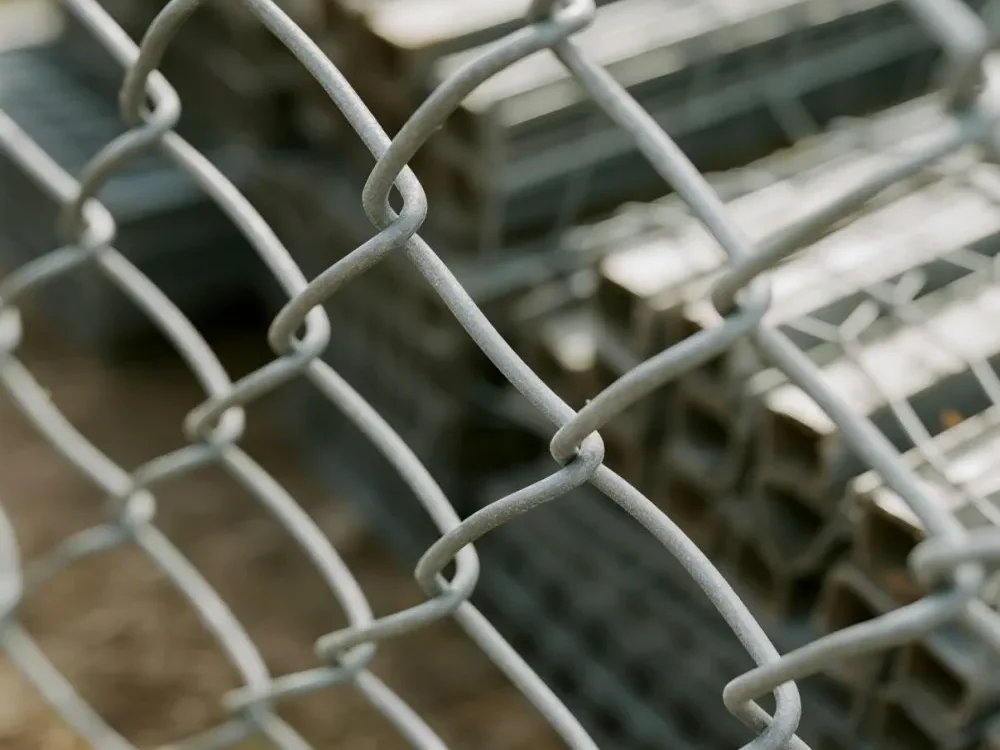 A close up shot of galvanized chain link fence